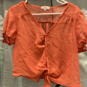 Orange blouse crop top see through.
